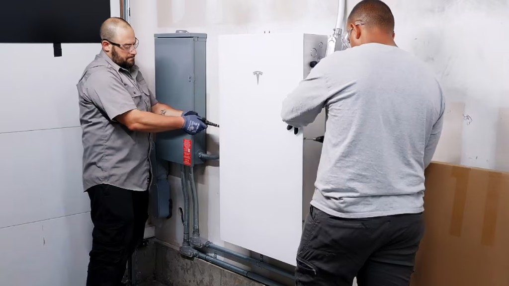 Leader Lights technicians installing Tesla home charging equipment